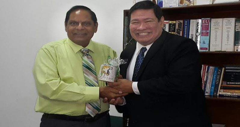 Prime Minister Moses Nagamootoo receives a gift from Mexican Ambassador Ivan Robero Sierra Medel