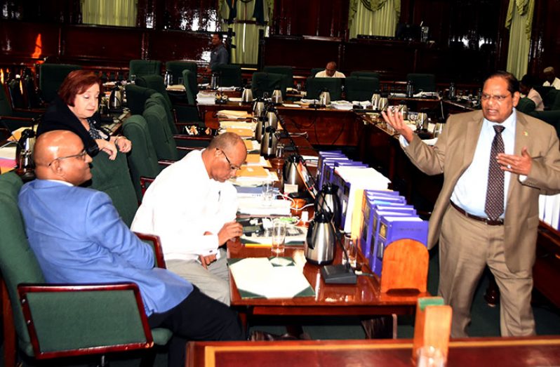 Prime Minister Moses Nagamootoo gesticulates before Opposition Leader Bharrat Jagdeo and other PPP MPs, Clement Rohee and Gail Teixeira in the Parliament Chamber on Friday last (Adrian Narine photo)