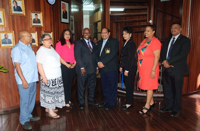 Prime Minister, Moses Nagamootoo, flanked by GNBA CEO, Dr. Prudence Lewis-Bhola (right) and the Board Chairman, Leslie Sobers (left), along with other Directors of the Board, including PPP executive, Bibi Shadick (Photo by Delano Williams)