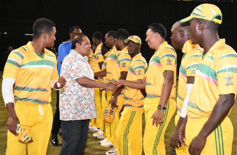 Skipper Rayad Emrit introduces the Caribbean All-Stars players to Prime Minister Moses Nagamootoo.