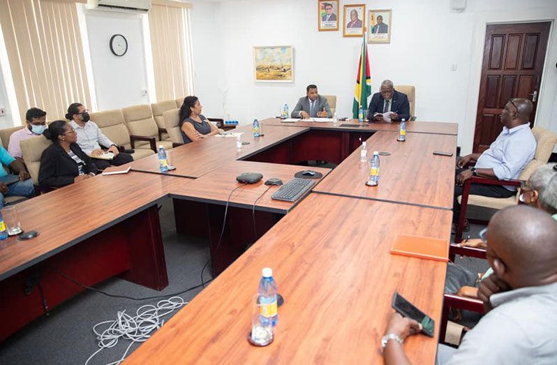 Prime Minister, Brigadier (Ret’d) Mark Phillips and Minister within the Ministry of Public Works, Deodat Indar engaging representatives of B&J Civil Works (Office of the Prime Minister photo)