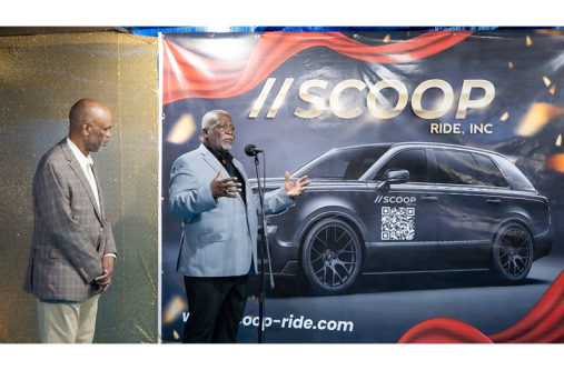 PM Phillips speaking at the launch of Scoop Ride Inc