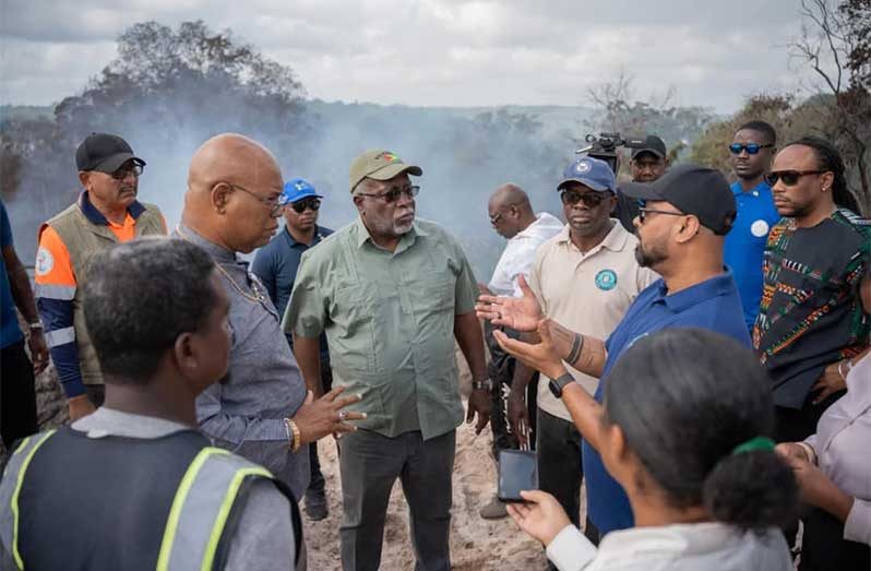 Prime Minister, Brigadier (Ret'd) Mark Phillips; Minister of Public Works, Bishop Juan Edghill; representatives from the GFS, the CDC, GWI, and the private sectors at the sawmill dump site in Linden, Region 10 (Upper Demerara-Upper Berbice), where the fire erupted almost a week ago.  The sawmill started operations more than 30 years ago (OPM photos)