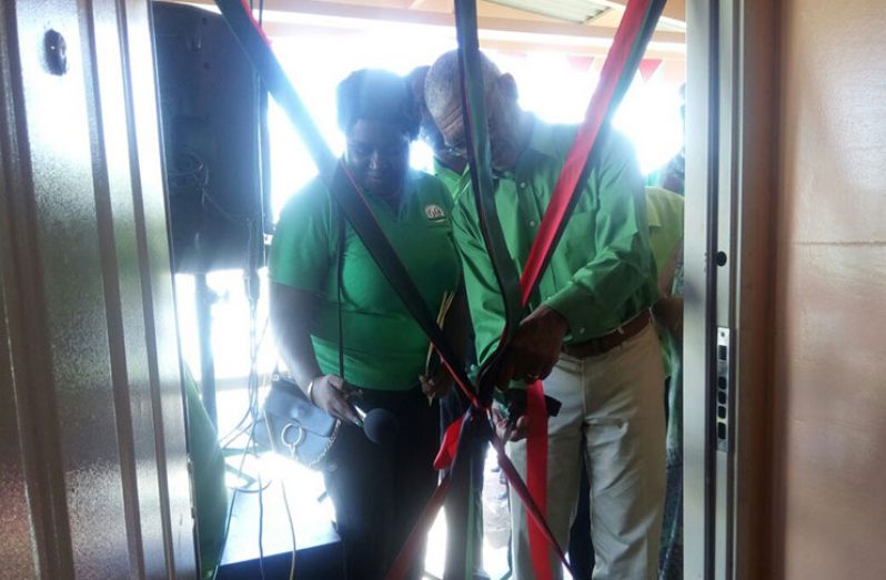 Party Leader, President David Granger, cutting the ribbon of the newly-refurbished party office with Regional Chairperson, Sandra Adams