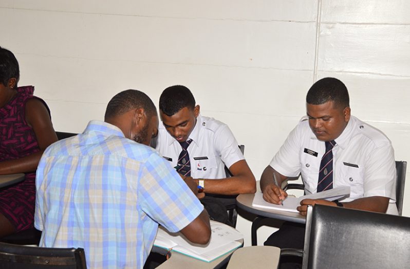 Students work in groups to better learn the Portuguese language (Adrian Narine photo)