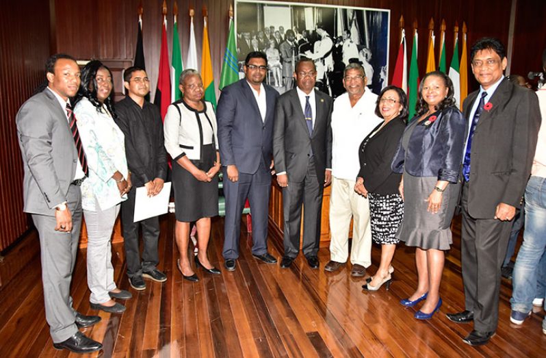 Newly-appointed members of the Public Procurement Commission stand with members of the Public Accounts Committee just after the swearing-in ceremony on Friday morning. (L-R)Jermaine Figueira (MP); Minister of Housing, Valarie Patterson; Sukrishnalall Pasha; Emily Dodson; Chair of the Public Accounts Committee, Irfaan Ali; Ivor Burnette English; Dr. Nanda Kishore Gopaul; Mrs. Carol Corbin; Minister of Social Protection, Volda Lawrence; and Charrandas Persaud, MP