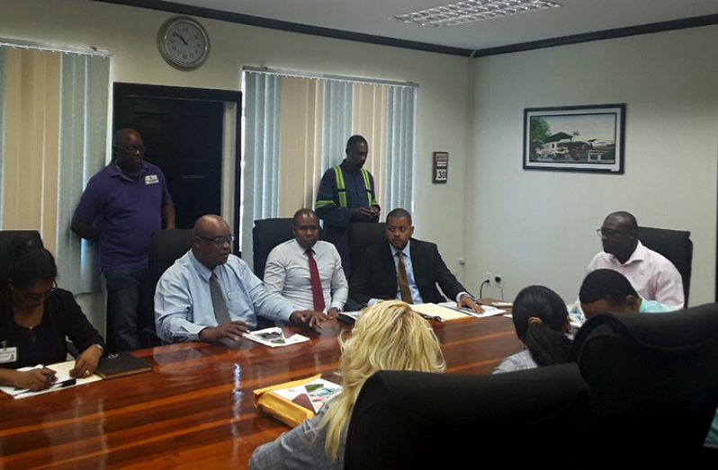 Minister of Public Infrastructure, David Patterson (right) listens as chairman of the board of the PPDI, Mark Bender makes a point at Monday’s annual general meeting. CEO of PPDI, Arron Fraser is at Bender’s left while company secretary, Ronald Burch-Smith is seated next to Fraser.