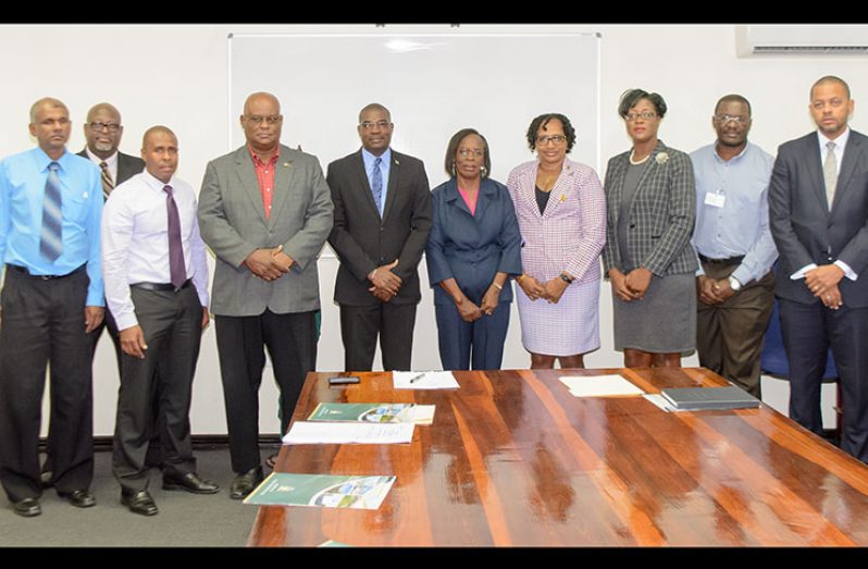 Ministers David Patterson and Minister within the Ministry, Annette Ferguson flanked by the new board members of PPDI. From left to right are, Harryram Parmesar; Stephen Fraser; CEO, Arron Fraser; Chairman, Mark Bender; Minister Patterson; Verlyn Klass; Minister Ferguson; Amanza Walton-Desir; MPI Permanent Secretary, Geoffrey Vaughn; and Secretary, Ronald Burch-Smith (Samuel Maughn Photo)