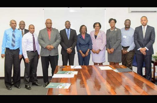 Ministers David Patterson and Minister within the Ministry, Annette Ferguson flanked by the new board members of PPDI. From left to right are, Harryram Parmesar; Stephen Fraser; CEO, Arron Fraser; Chairman, Mark Bender; Minister Patterson; Verlyn Klass; Minister Ferguson; Amanza Walton-Desir; MPI Permanent Secretary, Geoffrey Vaughn; and Secretary, Ronald Burch-Smith (Samuel Maughn Photo)