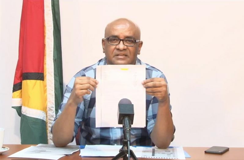 PPP/C General-Secretary Bharrat Jagdeo displays one of the certificates coming out of the national recount