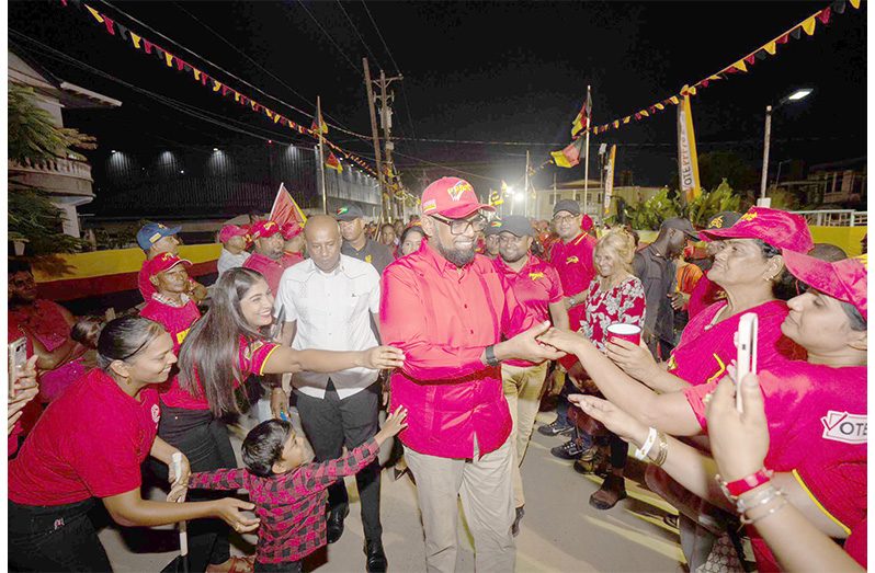President, Dr. Irfaan Ali engages supporters at the PPP/C’s Bush Lot public meeting, on Friday evening (NCN photo)