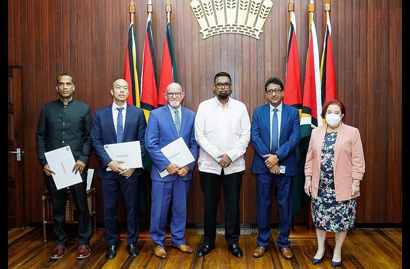 President Dr. Irfaan Ali; Attorney-General and Minister of Legal Affairs, Anil Nandlall, S.C. and Minister of Parliamentary Affairs and Governance, Gail Teixeira with the new PSC appointees (Office of the President photo)