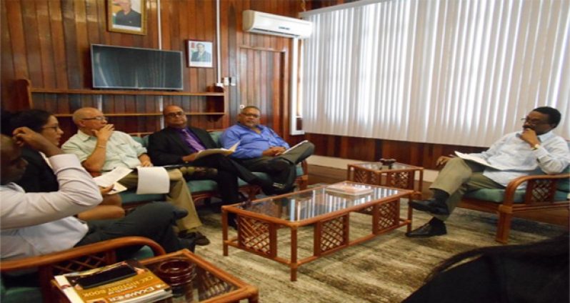 Attorney General, Basil Williams (right) in discussion with officials of the Private Sector Commission during their meeting on Thursday