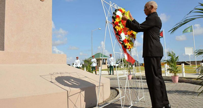 President David Granger lays a wreath at the
1823 Demerara Revolt Monument at Atlantic
Avenue on the Seawall Saturday (Latchman
Singh/Ministry of the Presidency photo