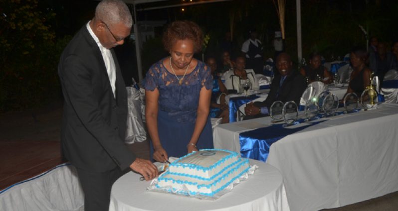 President David Granger and United Nations Resident Coordinator Khadija Musa cut an anniversary cake to mark 70 years since the establishment of the United Nations.