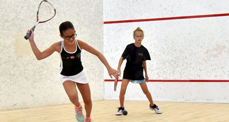 Guyana’s Paige Fernandes (left) in her battle for the Girls’ U-11 title against Darci Reich