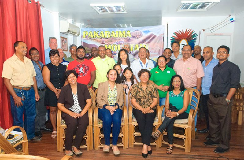 The ‘Safarians’ pose for a photo along with Minister within the Ministry of Indigenous Peoples’ Affairs, Valerie Garrido-Lowe (seated centre), along with a representative from the main sponsor, GuyOil (seated second from left) and GTA representative, Carla Persaud (seated second from right)