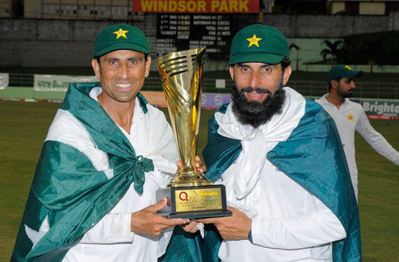 Younis Khan and Misbah-ul-Haq  pose with series trophy last Sunday at Windsor Park.