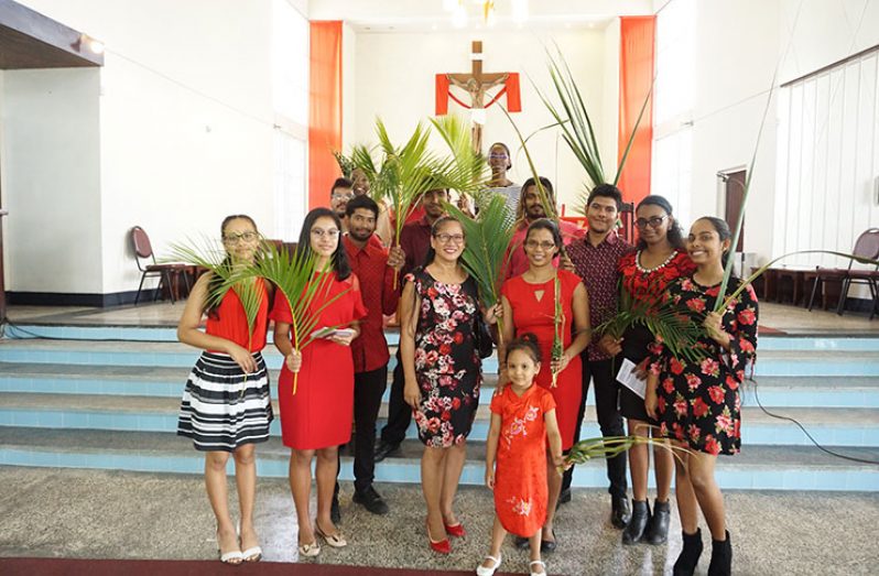 Members of Our Lady of Fatima Catholic Church celebrating Palm Sunday yesterday (Photo by Carl Croker)