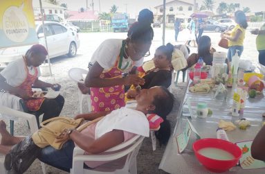 Females getting themselves pampered on May 8 at the Anna Regina Car Park, compliments of the Guyana Foundation Sunrise Centre
