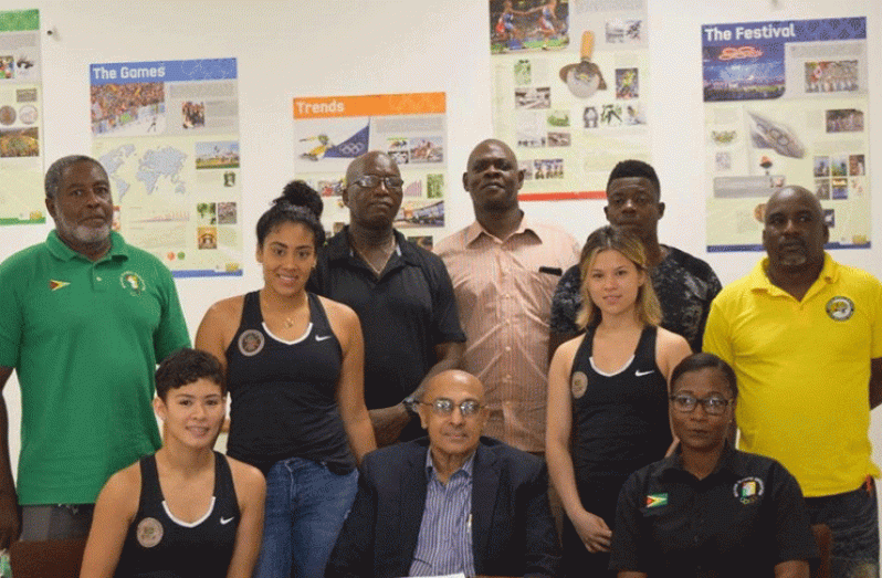 GOA president K.A. Juman Yassin (centre), General Secretary Hector Edwards (standing far left) and Administrative Secretary and Chef-de-Mission for the Pan-Am Games Nalini McKoy (sitting right) along with some coaches and athletes who will represent Guyana in Peru.