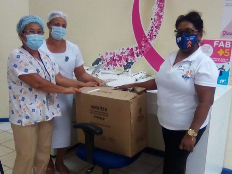 GTT representative, Ms. Avril Bacchus (right) presenting President and Secretary of the Linden Cancer Society, Dr. Salome Henry and Ms. Dawn Bagot respectively with pap smear kits and hygienic packages