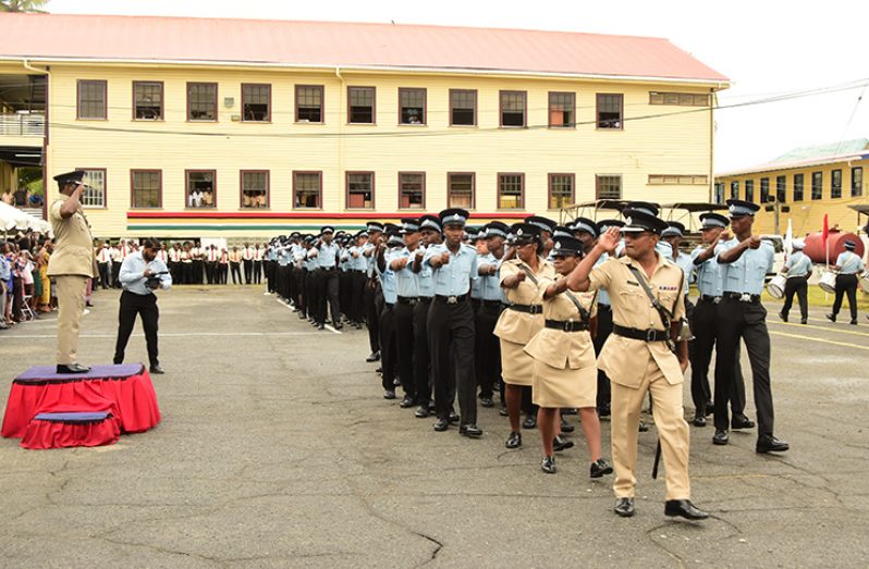 Assistant Commissioner of Police (ag), Paul Williams taking the salute at Friday’s passing out parade