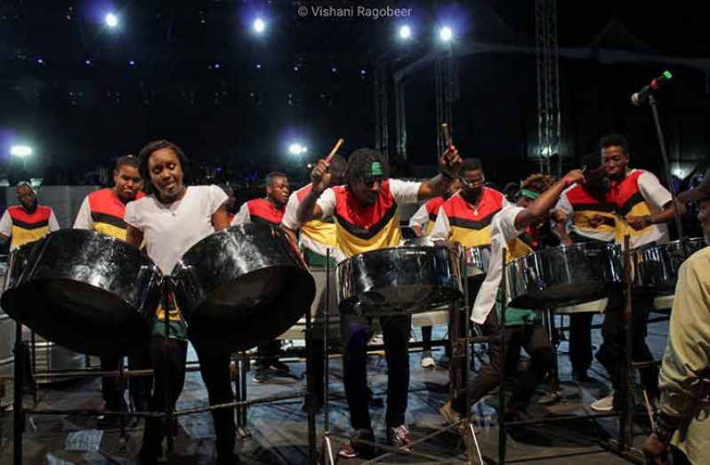 Members of the National Steel Orchestra 'vibing' as they entertained the crowd at the Queen's Park Savannah during the Pan and Powder event held on Wednesday night (Vishani Ragobeer photo)