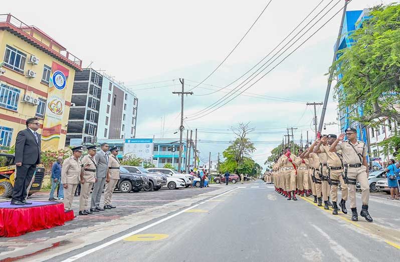 Senior Minister Dr Ashni Singh receives the traditional ‘eyes right’ salute during the Guyana Police Force's annual Route March Parade on Saturday, in front of the Ministry of Home Affairs, as part of the Force's 187th anniversary celebrations