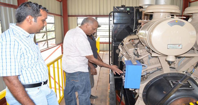 Minister of Agriculture Dr. Leslie Ramsammy and CEO, National Drainage and Irrigation Authority, Mr Lionel Wordsworth inspect the pump at the Paradise pump station