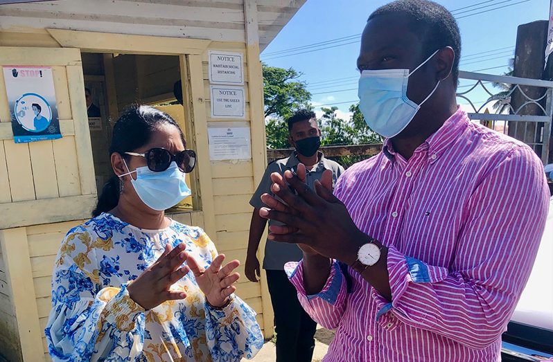 Public Service Minister Sonia Parag engages Foreign Affairs Minister Hugh Todd at the Johanna Cecelia Secondary School, ahead of the outreaches