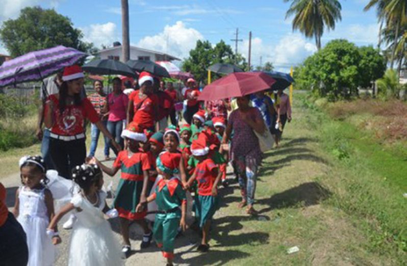 Students of Woodley Park Nursery School accompanied by their teachers as they participated in their annual Christmas Road Parade