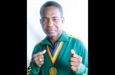 Mike Parris with his bronze medal and national tracksuit he wore in 1980 in Moscow