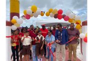 Director General of the Ministry of Agriculture Madanlall Ramraj joins residents in cutting the ribbon to officially open the Cheddi Jagan Play Park.
