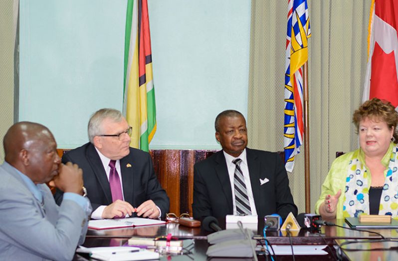 Speaker of the Legislative Assembly of the Province of British Columbia, Linda Reid makes a point in the presence of Speaker of the National Assembly of Guyana, Dr. Barton Scotland, Canadian High Commissioner to Guyana and Suriname, Pierre Giroux and Clerk of the National, Sherlock Isaacs