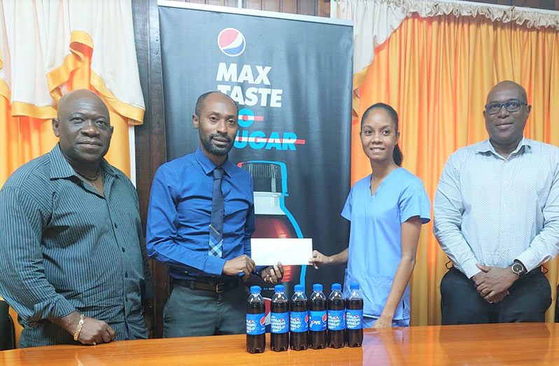 DDL Brand Manager, Larry Wills, presents his company’s cheque to GBA vice-president Marissa Parris. Also in the photo are GBA executive member Seon Bristol and GBA president Steve Ninvalle.