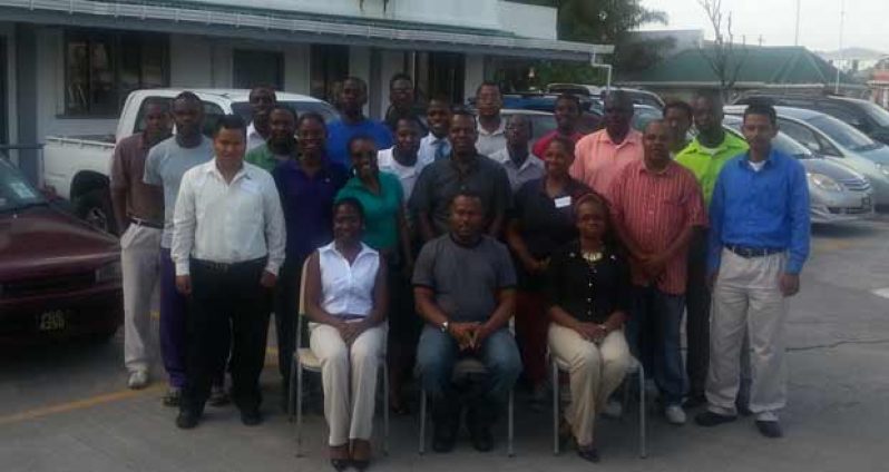 The 24 participants of the just concluded Centres for Disease Control and Prevention (CDC), in collaboration with the Ministry of Health and Petra Organisation two-day seminar on Gender Base Violence, pose with, seated from left, Joy Gravesande, Troy Mendonca and Dr Ertenisia Hamilton.