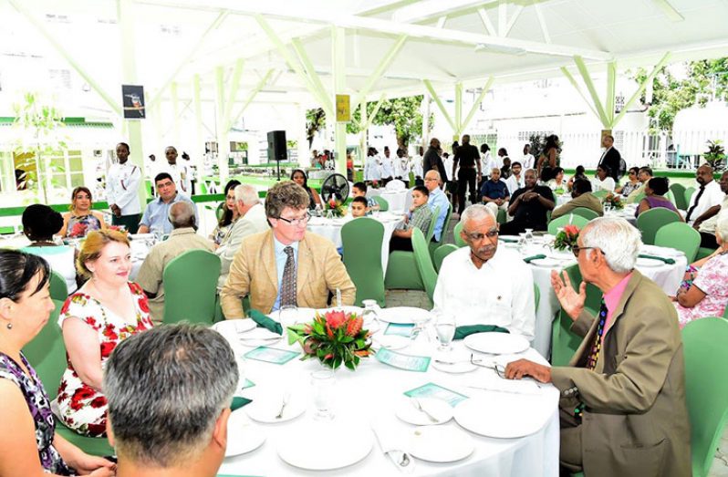 President David Granger hosted a fundraising luncheon for the St. John’s Association of Guyana, of which he is the patron, at the Baridi Benab at State House. In this photo the Head of State is chatting with the Chairman of the Association, Vibert Parvatan and British High Commissioner Greg Quinn 