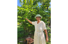 Parvati Loaknauth in her well-cultivated backyard