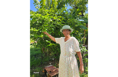 Parvati Loaknauth in her well-cultivated backyard