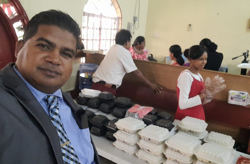 Pastor of the Kaneville New Testament Baptist Church, Ram Angad, at the hot meal distribution on Sundays for children