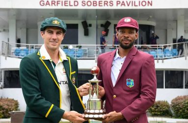 Pat Cummins and Roston Chase with the Frank Worrell Trophy • Getty Images, AFP