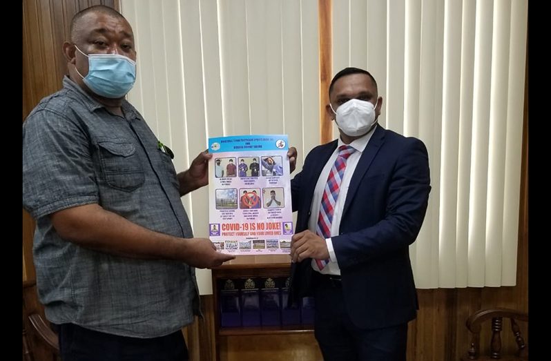 BCB Patron, Minister Vickram Bharrat, and Hilbert Foster launch the joint RHTYSC/BCB Poster campaign.