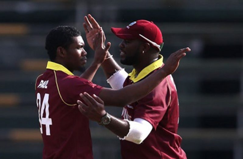 Keemo Paul (left) is congratulated by Ashley Nurse after taking a wicket during his maiden ODI on Thursday.