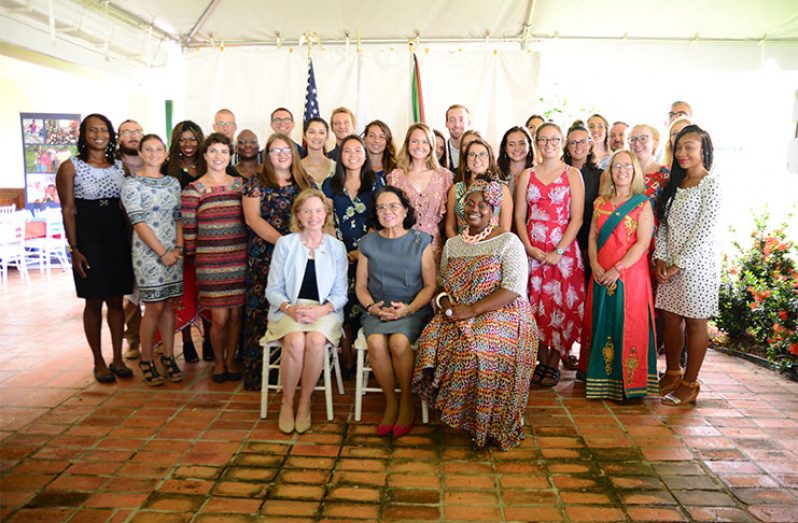First Lady Sandra Granger (Seated in the centre) flanked by US Ambassador to Guyana, Sarah-Ann Lynch and Peace Corps Country Director, Kury Cobham with the 32nd batch of Peace Corps volunteers (Samuel Maughn photo)