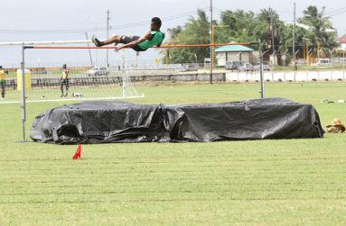 Boys high jump winner, Guyana’s Kade Pearce, clears the bar