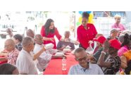 Minister of Human Services and Social Security, Dr Vindhya Persaud, engages pensioner