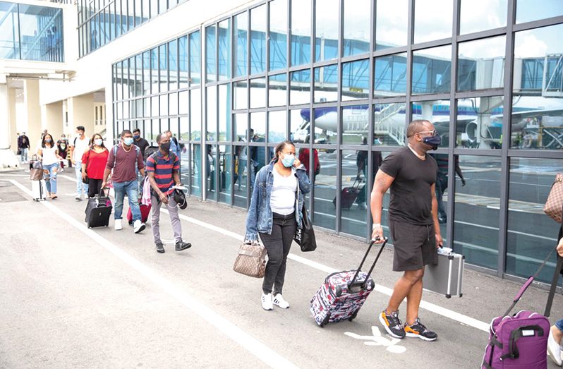Passengers arriving at the CJIA on the first commercial flight to Guyana since the formal reopening of the airport