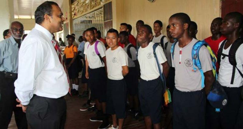 Minister Anthony interacting with some of the new students on arrival at the Centre