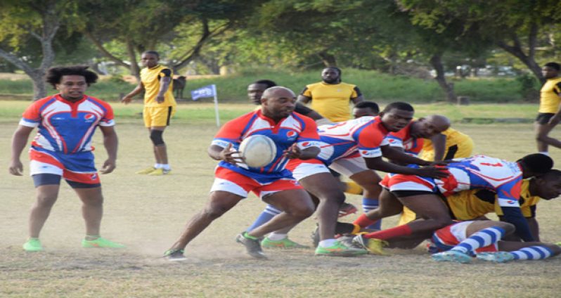 Pepsi Hornets’ Elwin Chase on his way to scoring a try during his side’s 38 – 20 win over Yamaha Caribs.